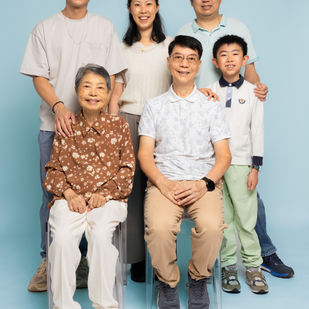 a group of people posing for a picture including an elderly woman