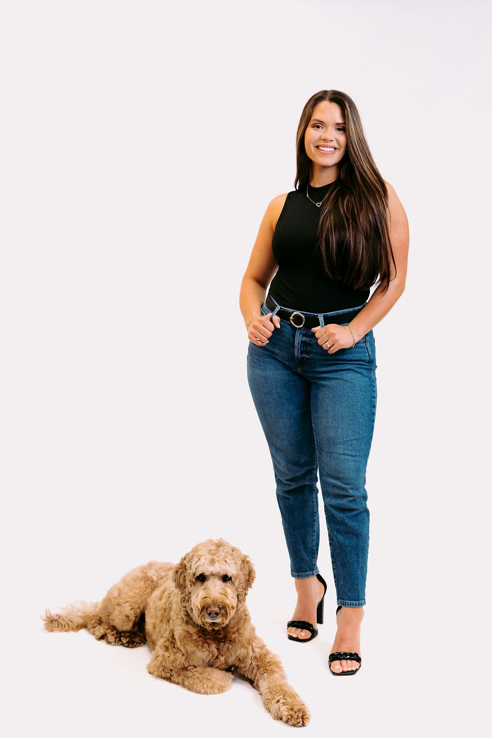 Studio image of the owner Bekah with her dog Baylor laying down