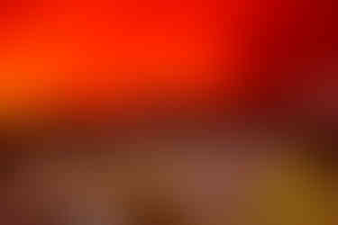 AI edited image of houses in the Alps, with wildfire in the background