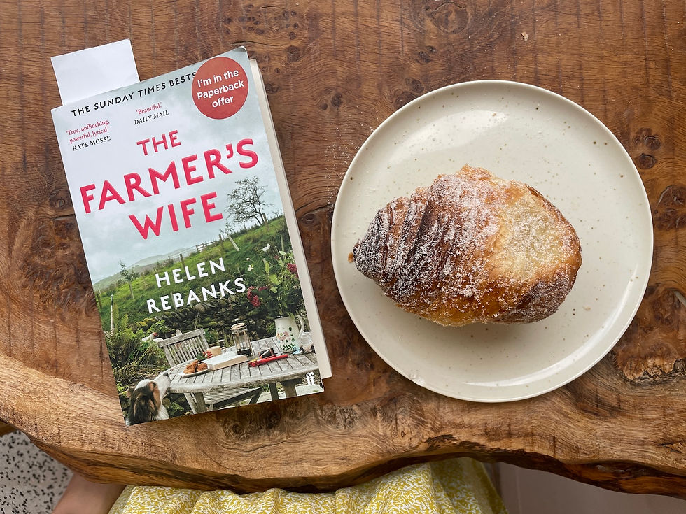 The Farmer's Wife book by Helen Rebanks, alongside a pastry
