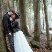 bride and groom embracing at ethereal forest wedding