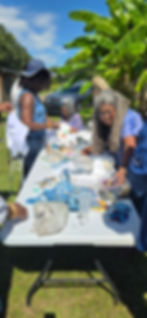 Arianne King Comer and attendees working on their indigo textiles