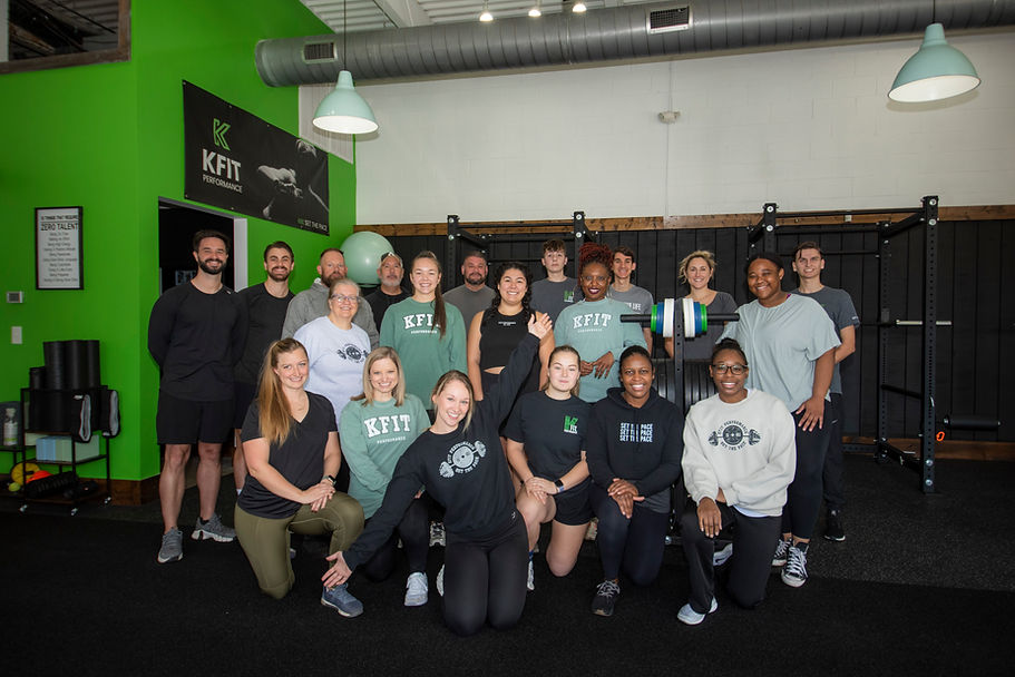 Kylie Pace, personal trainer and a group of her clients inside the KFit Performance gym