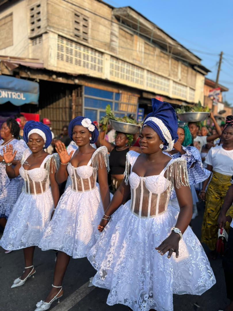 Triplets elegantly dressed in white lace participate in their annual duties at the GA Mashie Homowo festival.