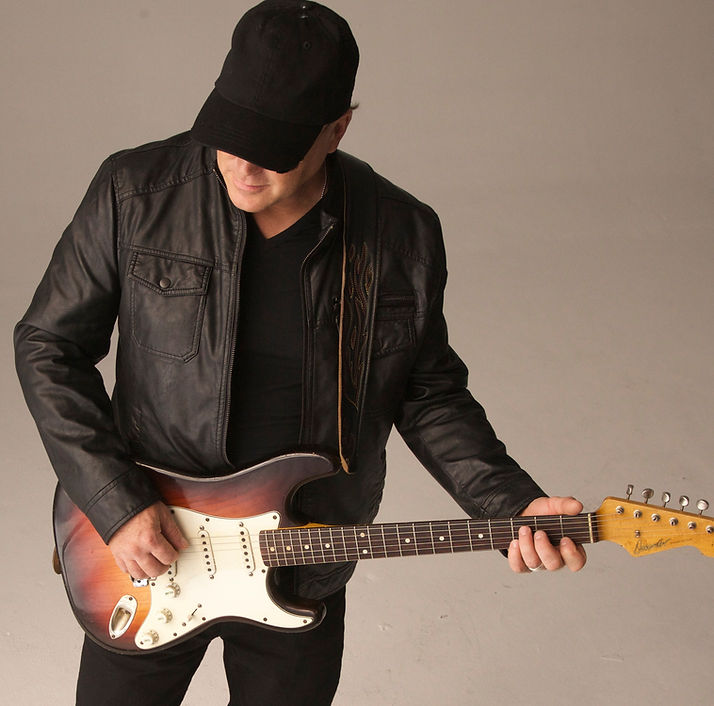 Brent Daniels, a country music singer holding a guitar