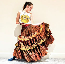 girl posing with flowy skirt and earthwatch cropped flower vest