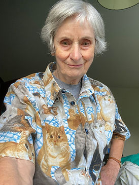 Woman posing wearing handmade shirt with cats all over