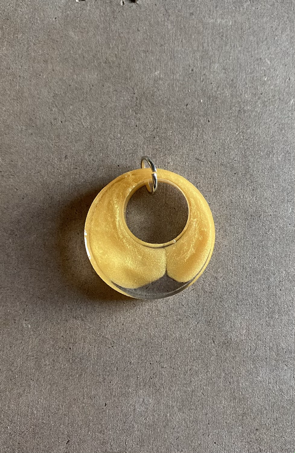 Clear and gold circle resin pendant
