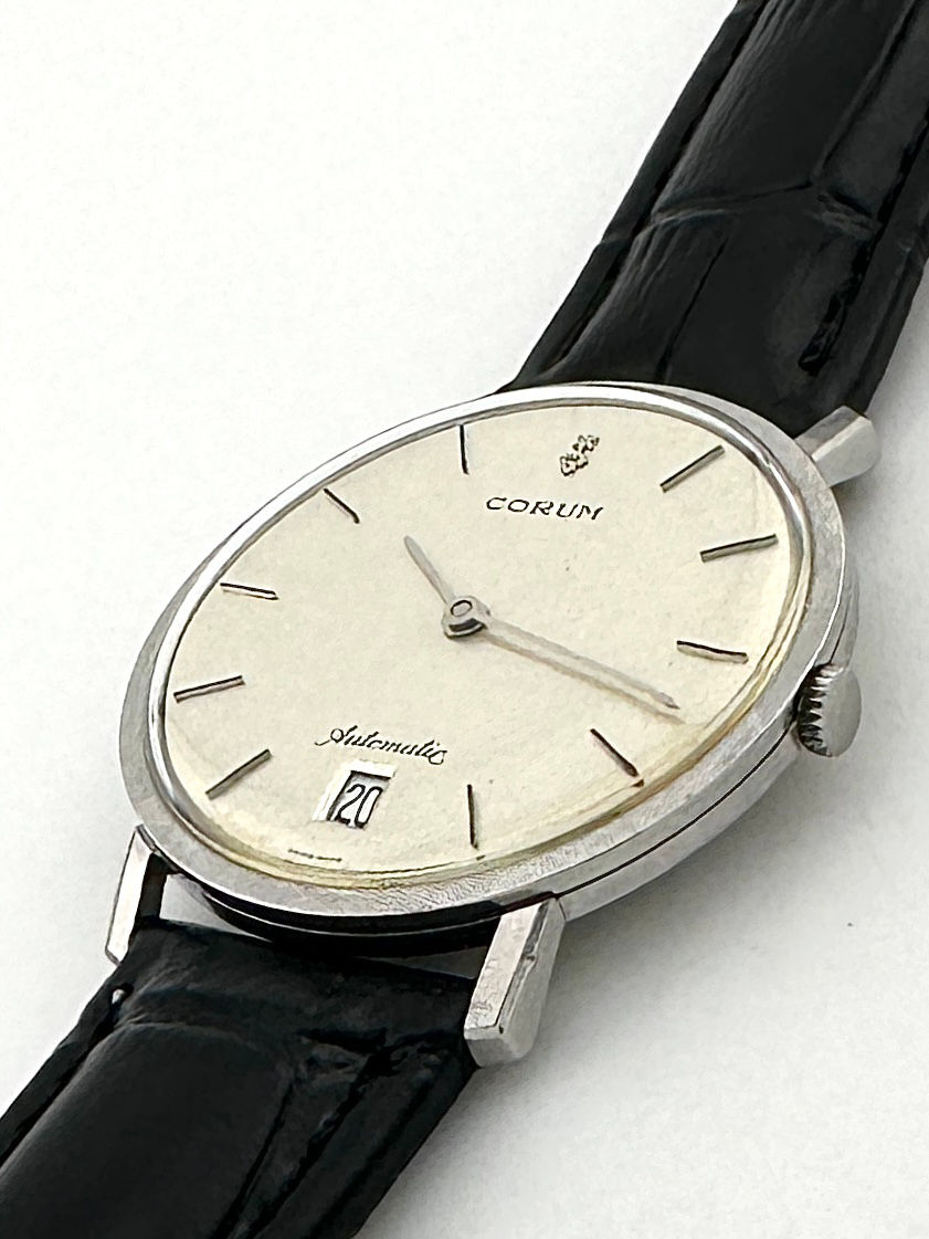 サムネイル： CORUM リネン文字盤 デイト