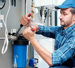 Plumber Installing a water filter system