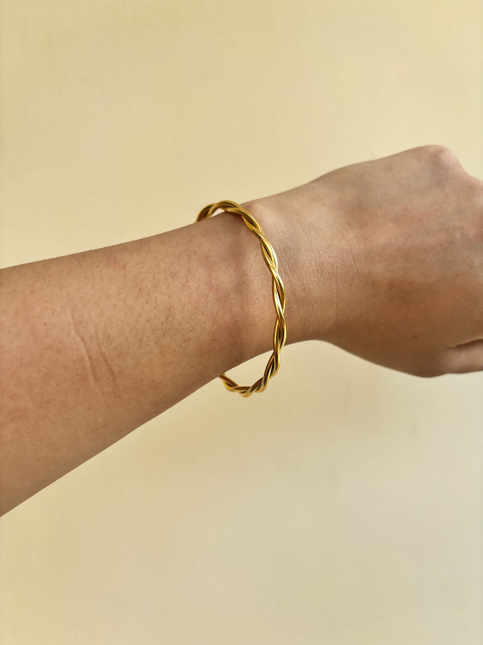 Gold twisted open kada bangle in anti-tarnish stainless steel