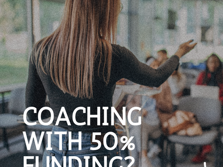 Skills Boost Approved Provider promotional image showing a woman speaking to a group, with text overlay reading ‘Coaching with 50% funding? Yes please!’