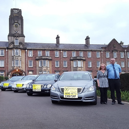 A fleet of taxis in front of a residential building