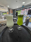 Two drinks on a tray in a restaurant: a refreshing sight of beverages ready to be served.
