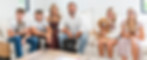 Picture of Robert and family sitting on the couch in their family home