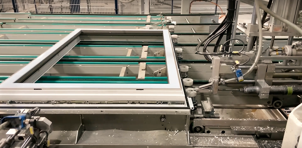 A photo of schlüters manufacturing facility showing a machine inserting screws into a pvc window