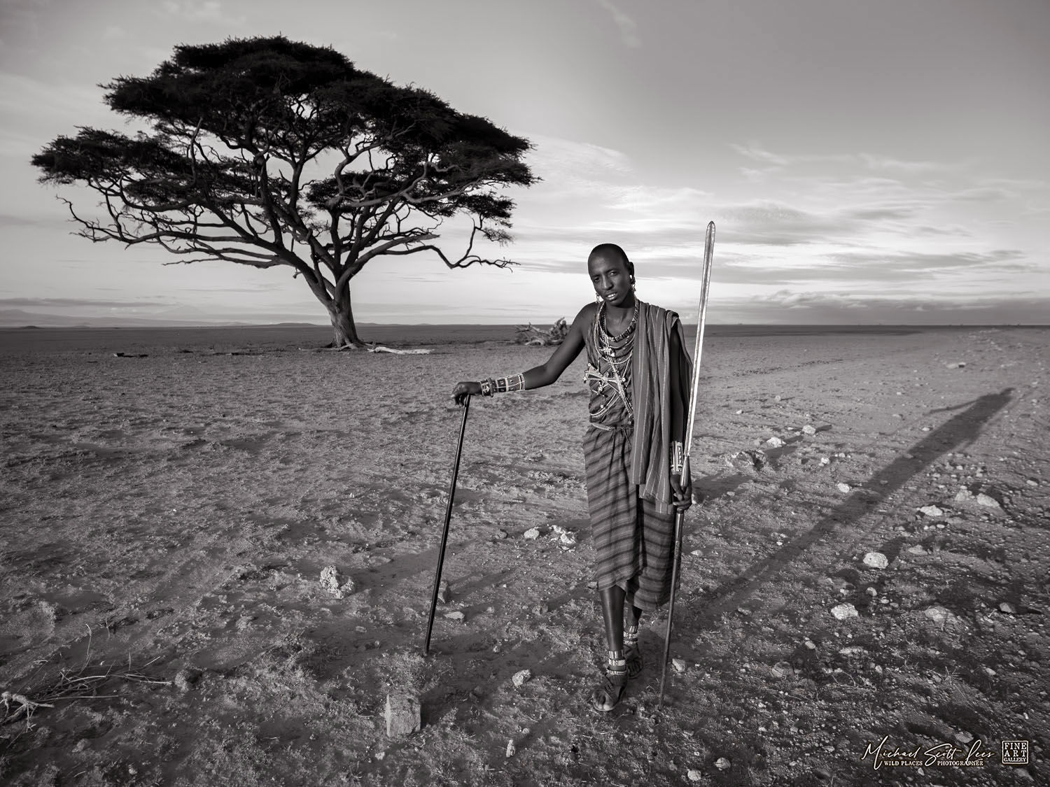 Maasai Tribesman with acacia tree in Amboseli National Park, Kenya, Africa, Michael Scott Lees fine art photographic prints