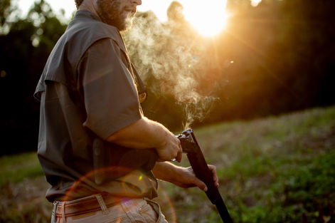 Outdoor photographer: Virginia commercial photographer: A man expels shotgun cells from an over-under.
