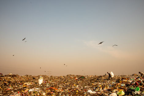 International Humanitarian Photographer. Trash dump in Pune, India.
