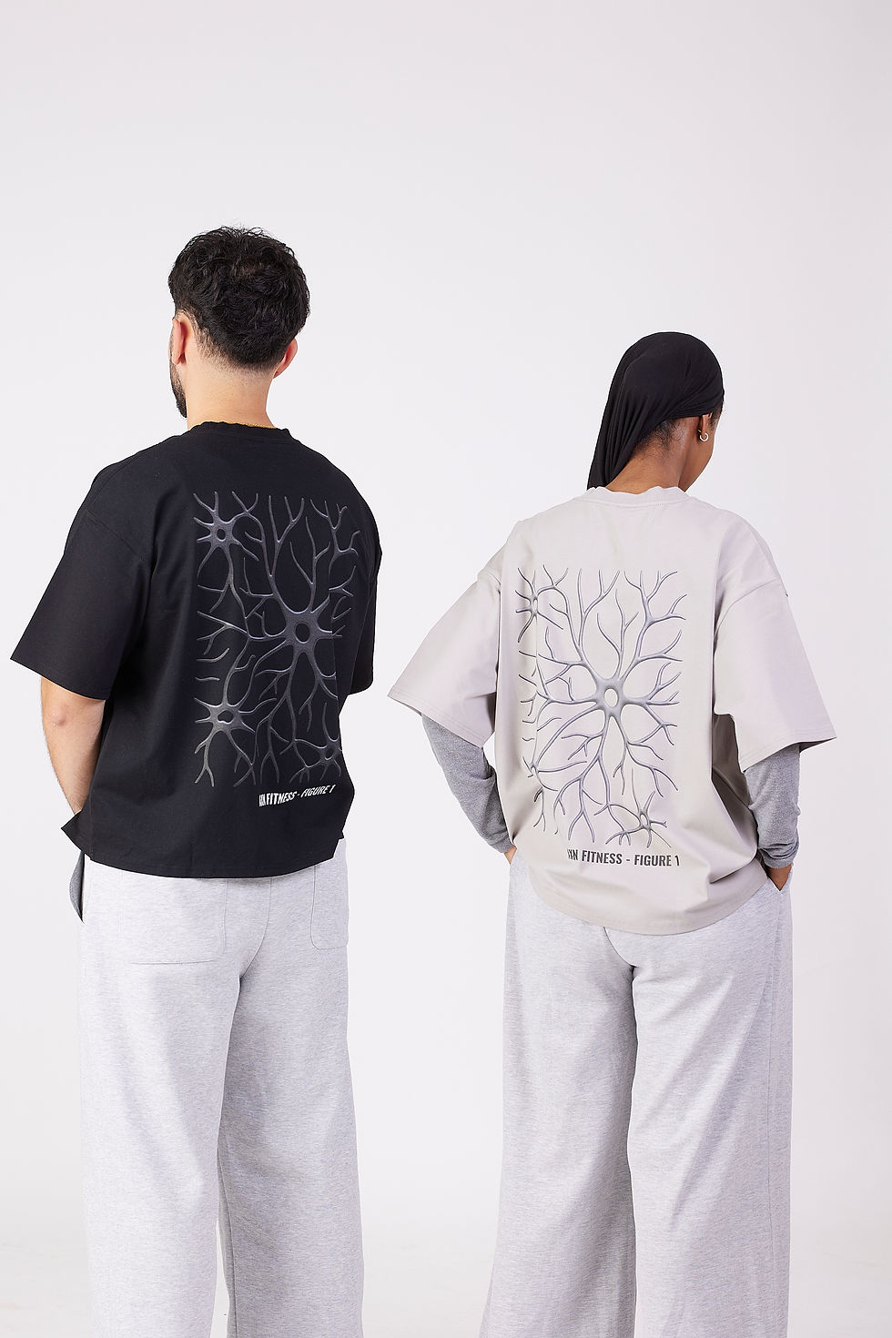 Two people wearing Clothing with neuron graphic prints.