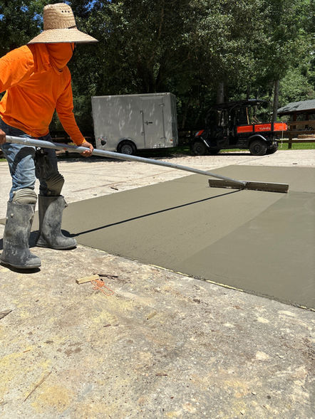 Contractor finishing concrete in The Woodlands