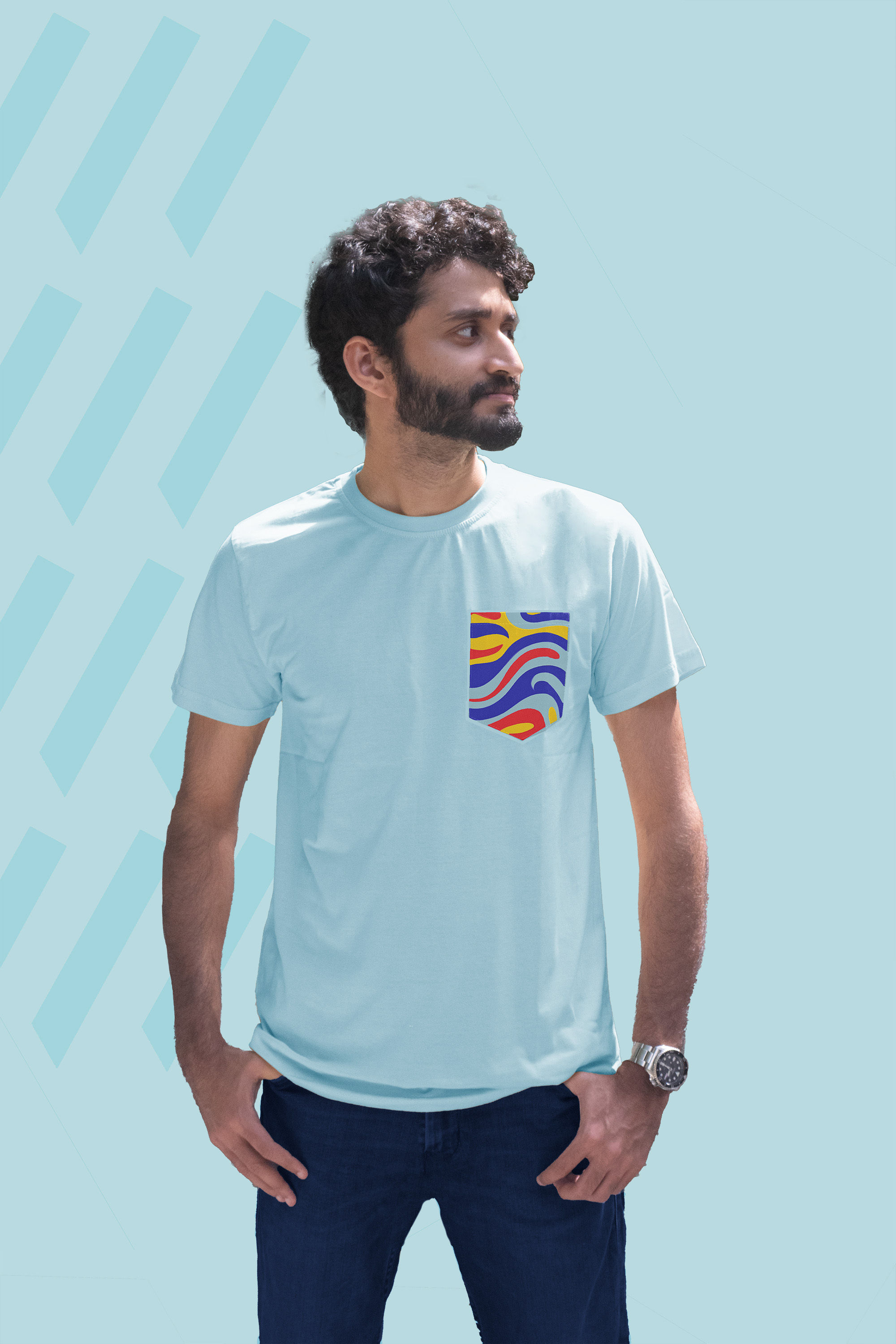 Guy wearing a plain light blue t-shirt with a pocket screen printed with a fun design