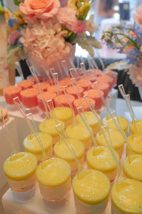 Key lime pie shooters and strawberry shooters displayed with fresh spring florals.