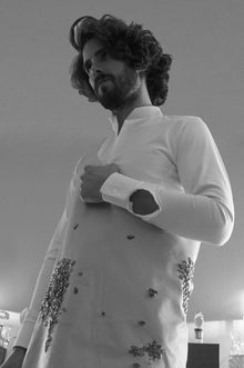 A butcher apron, made out of real leather, embroidered with red rhinestones, made to look like blood