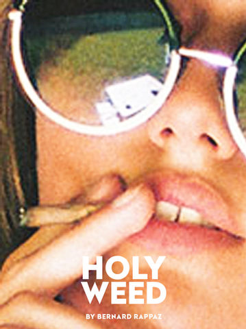 A close up of a model, consuming HOLYWEED products 