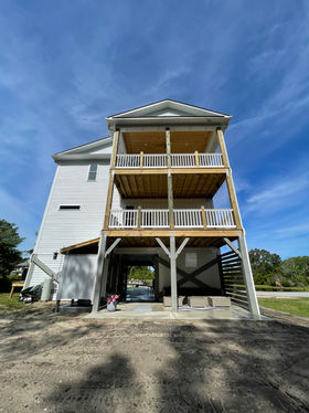 home located in emerald isle cleaned by soft wash and pressure washing including the 3 story wooden decks and outdoor areas