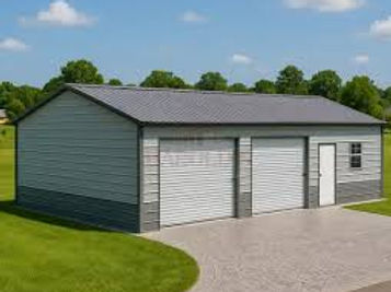 Gray metal building with two large garage doors and side door.
