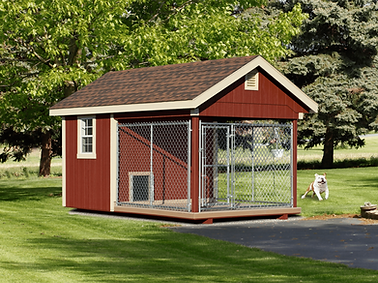 Red wooden Dog Kennels featuring an attached chain-link outdoor run.
