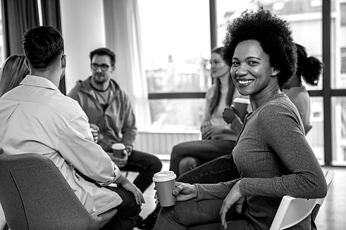 diverse-group-of-people-sitting-in-circle-in-group-2023-11-27-05-35-37-utc_edited.jpg
