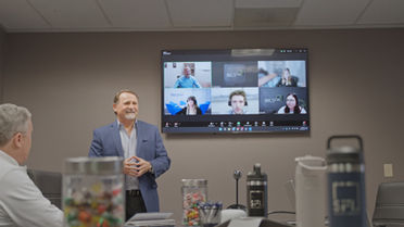 Sales Focus Inc executive presenting during team meeting — brand film by Boda Studios Charleston SC
