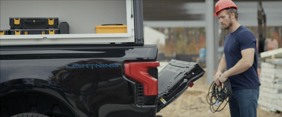 Worker unloading equipment from Ford Lightning at job site — Ranger Design lifestyle film by Boda Studios