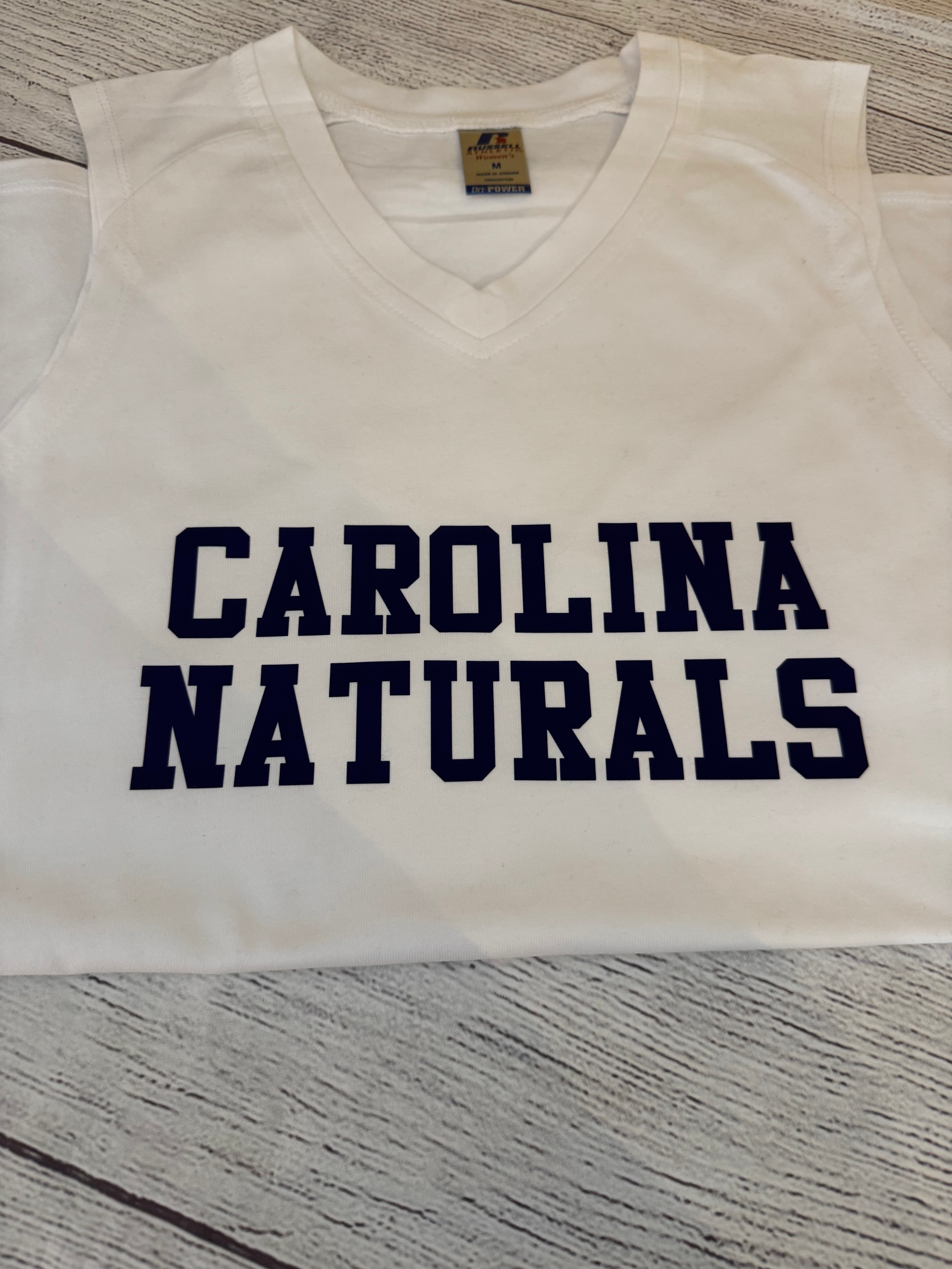 Women’s medium white tank with Carolina naturals in blue 