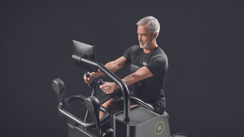 older fit man working out on technogym machine