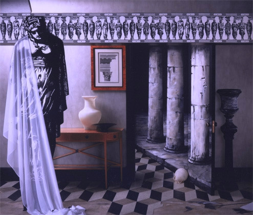 pillars painted on a wall with an existing door