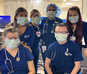 Medical students wearing scrubs. The scrubs are matching with personalized designs.