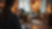 Eye-level view of a person filming a vlog with a camera on a tripod in a cozy indoor setting