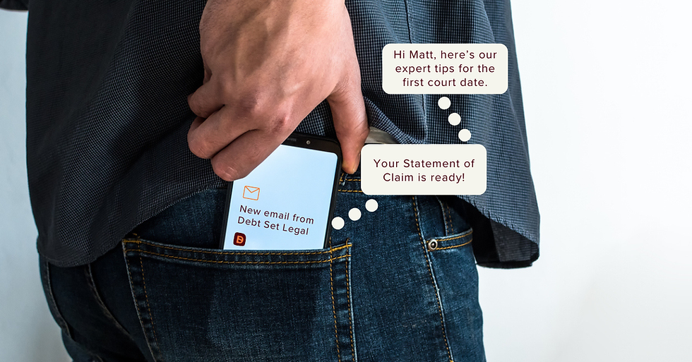 Person reaching for their phone to open an email notification from Debt Set Legal about their statement of claim