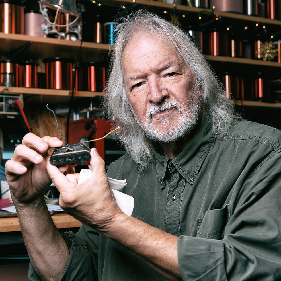 Seymour W. Duncan holding a vintage telecaster bridge pickup