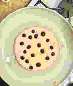 GF Blueberry Pancake cooking in pan