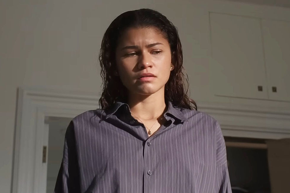 Zendaya stood looking upset with wet hair