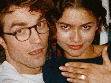 Zendaya and Robert Pattinson posing