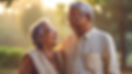 senior-indian-couple-holding-hands-close-proximity-while-smiling-laughing-twilight-park-ne
