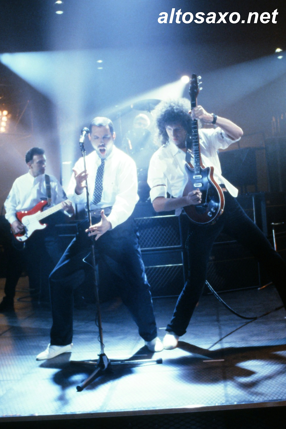 John Deacon, Freddie Mercury, and Brian May of Queen perform at the music video of 'I Want It All', filmed at Elstree Studios, London in March 1989.