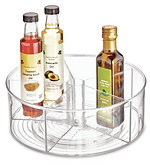 Rotating Lazy Susan organiser holding jars and bottles in a kitchen cupboard
