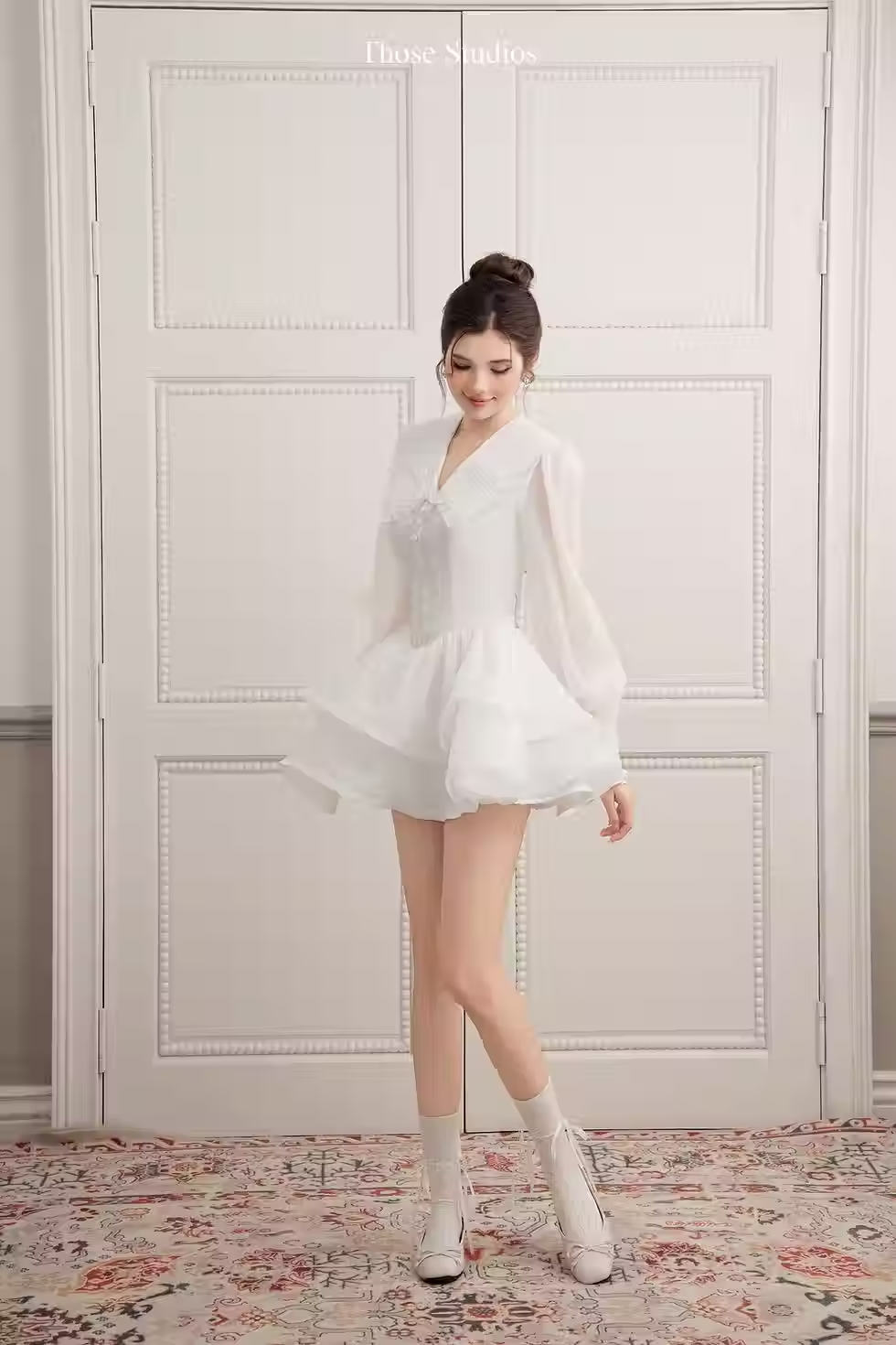 Model wearing white V neck long sleeve flare dress in soft chiffon, layered A-line skirt, feminine, elegant style.
