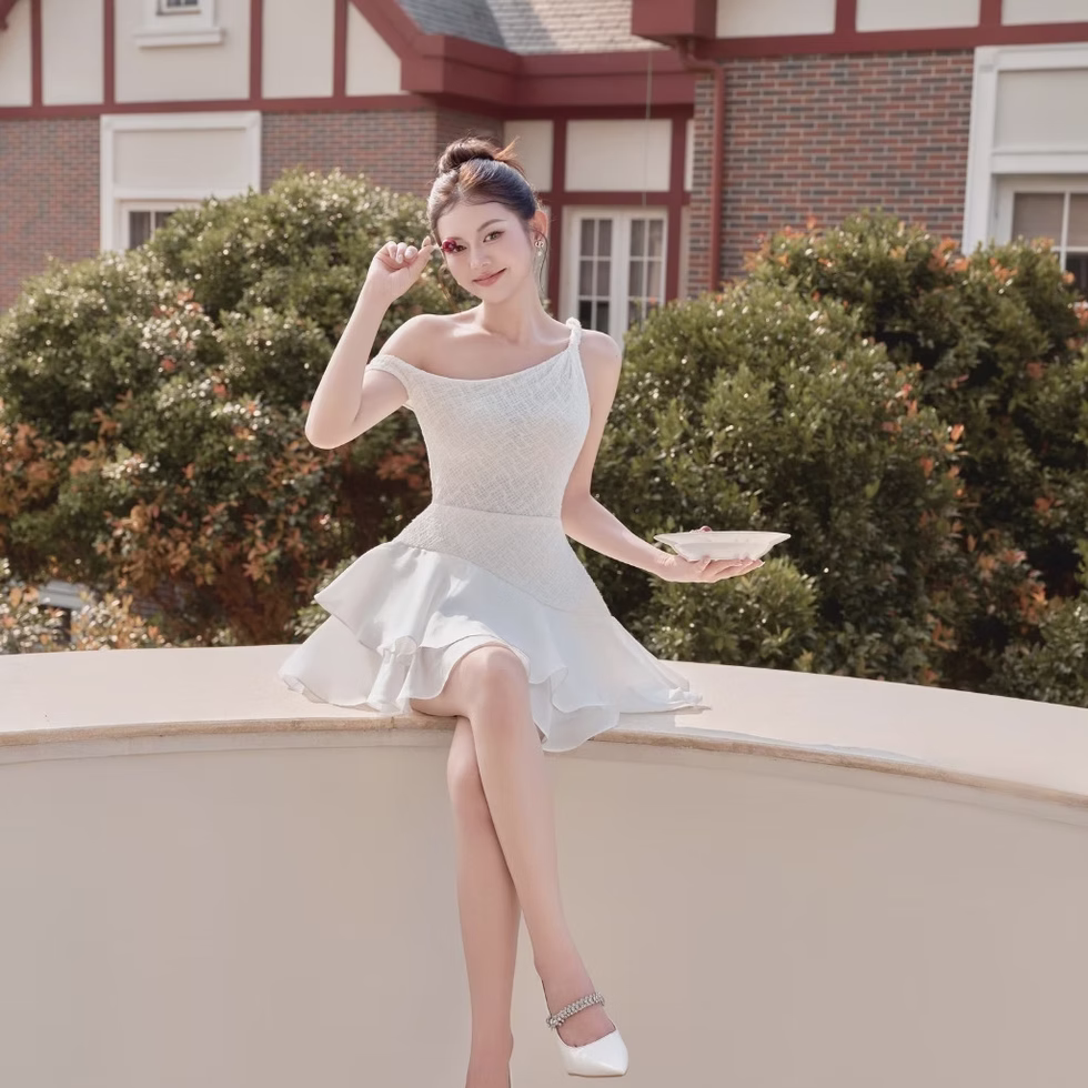 Elegant one-shoulder white mini dress by Those Studios, perfect for parties, dates, photoshoots, and brunches.